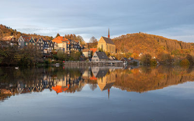 Beyenburg lake with water reflection and autumnal colors, wuppertal, bergisches land, germany