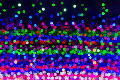 Defocused image of illuminated lights at night