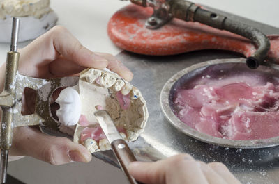 Close-up of hand holding ice cream