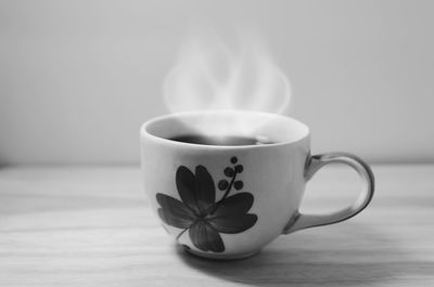 Close-up of coffee cup on table