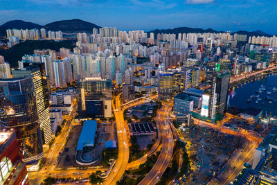 Aerial view of modern buildings in city at night