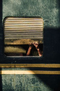 Rear view of low section of person