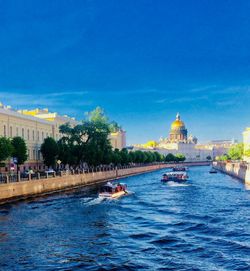 View of canal and buildings in city