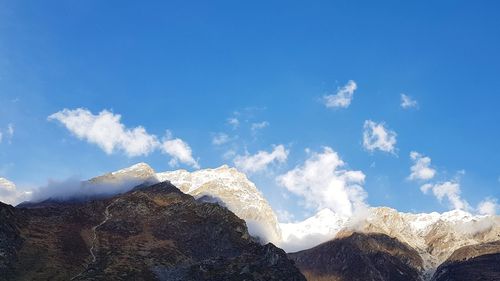 Panoramic view of snowcapped mountains against sky