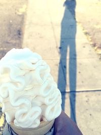 Close-up of hand holding ice cream