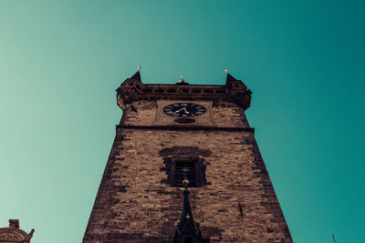 Low angle view of clock tower against sky