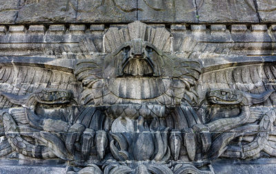 Close-up of carvings on stone wall