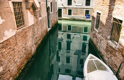 High angle view of canal amidst buildings