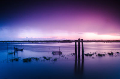 Scenic view of calm sea at sunset