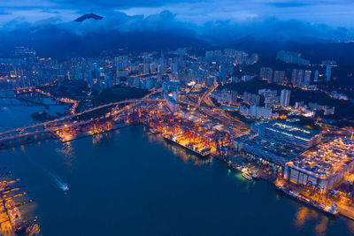 High angle view of illuminated buildings in city at night