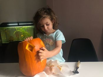 Girl sitting on table