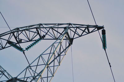 Low angle view of cables against clear blue sky