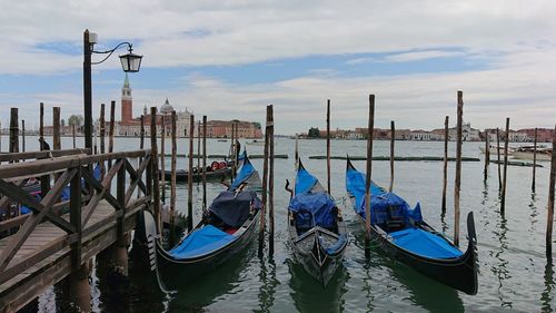 Boats moored in canal