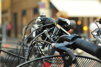 Close-up of bicycle on metal bridge