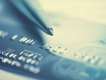 Close-up of pen and credit card
