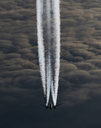 Low angle view of airplane flying in sky