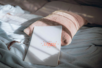 Close-up of gift box on bed