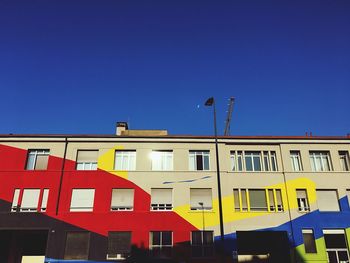 Low angle view of building against blue sky