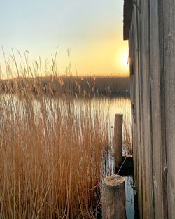 Scenic view of lake against sky during sunset