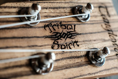 Close-up of text on ukulele headstock