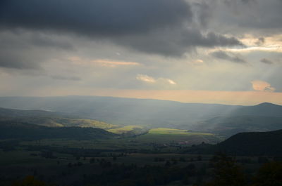 Scenic view of landscape against sky during sunset