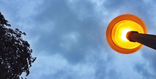 Low angle view of cloudy sky at sunset