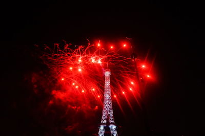 Low angle view of firework display at night