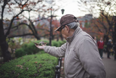 Midsection of man in park during winter