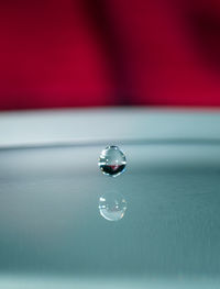 Close-up of water drop on table