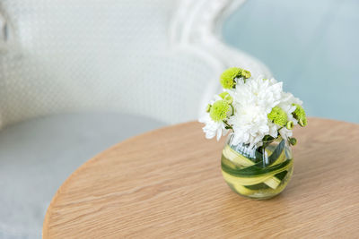 Close-up of white flower vase on table