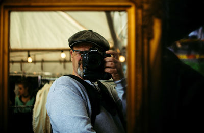Portrait of man photographing