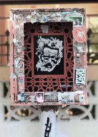 Graffiti on city against sky