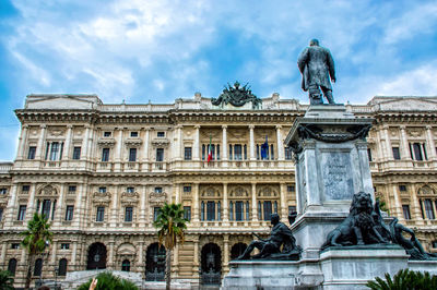 Low angle view of historical building against cloudy sky