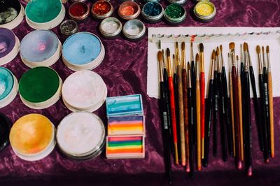 High angle view of various art and craft equipment on table