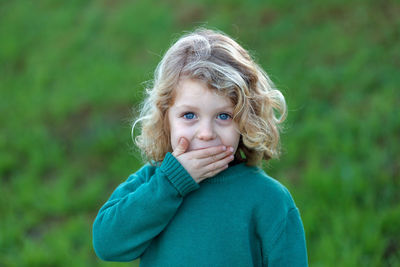 Portrait of cute girl standing outdoors