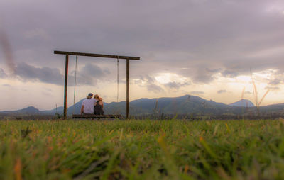 Man on agricultural field against sky