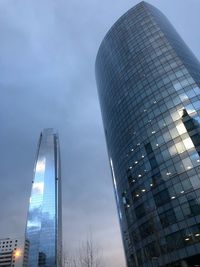 Low angle view of modern buildings against sky