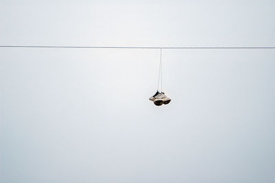 Low angle view of boat in sea against clear sky