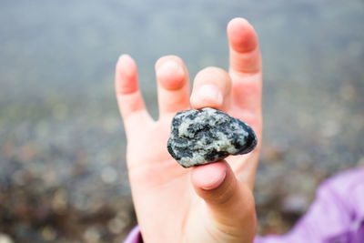 Close-up of person holding hand