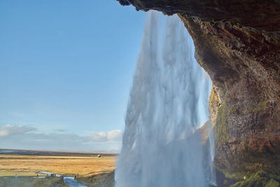 Panoramic view of sea and rocks against sky