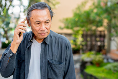 Senior man using phone