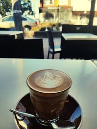 Close-up of coffee cup on table