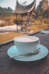 Close-up of coffee cup on table