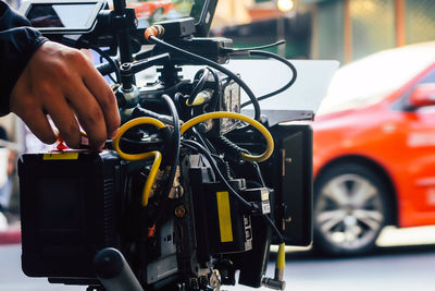 Cropped hand of man repairing car