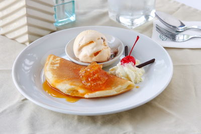 High angle view of fresh dessert served in plate on table at restaurant