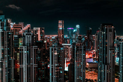 Illuminated buildings in city at night