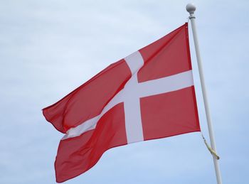 Low angle view of flag against the sky