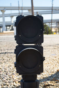 Close-up of camera against sky