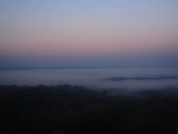 Scenic view of silhouette landscape against sky during sunset