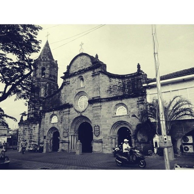 architecture, building exterior, transfer print, built structure, church, religion, place of worship, auto post production filter, spirituality, cathedral, low angle view, arch, sky, facade, city, day, travel destinations, incidental people